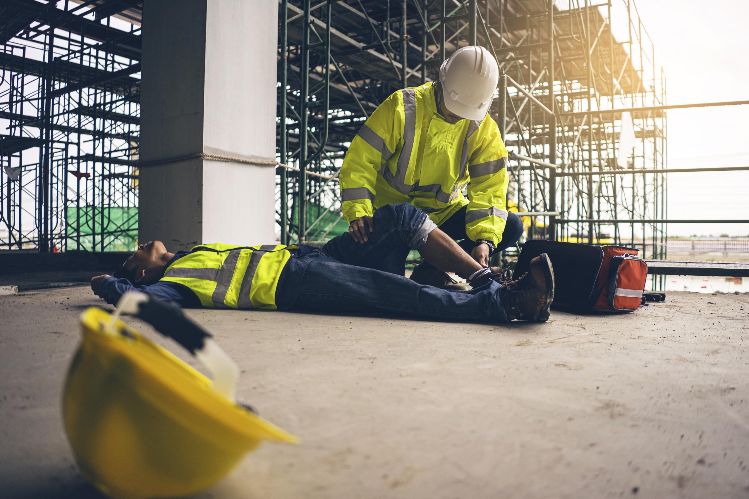 Man assessing a workplace injury