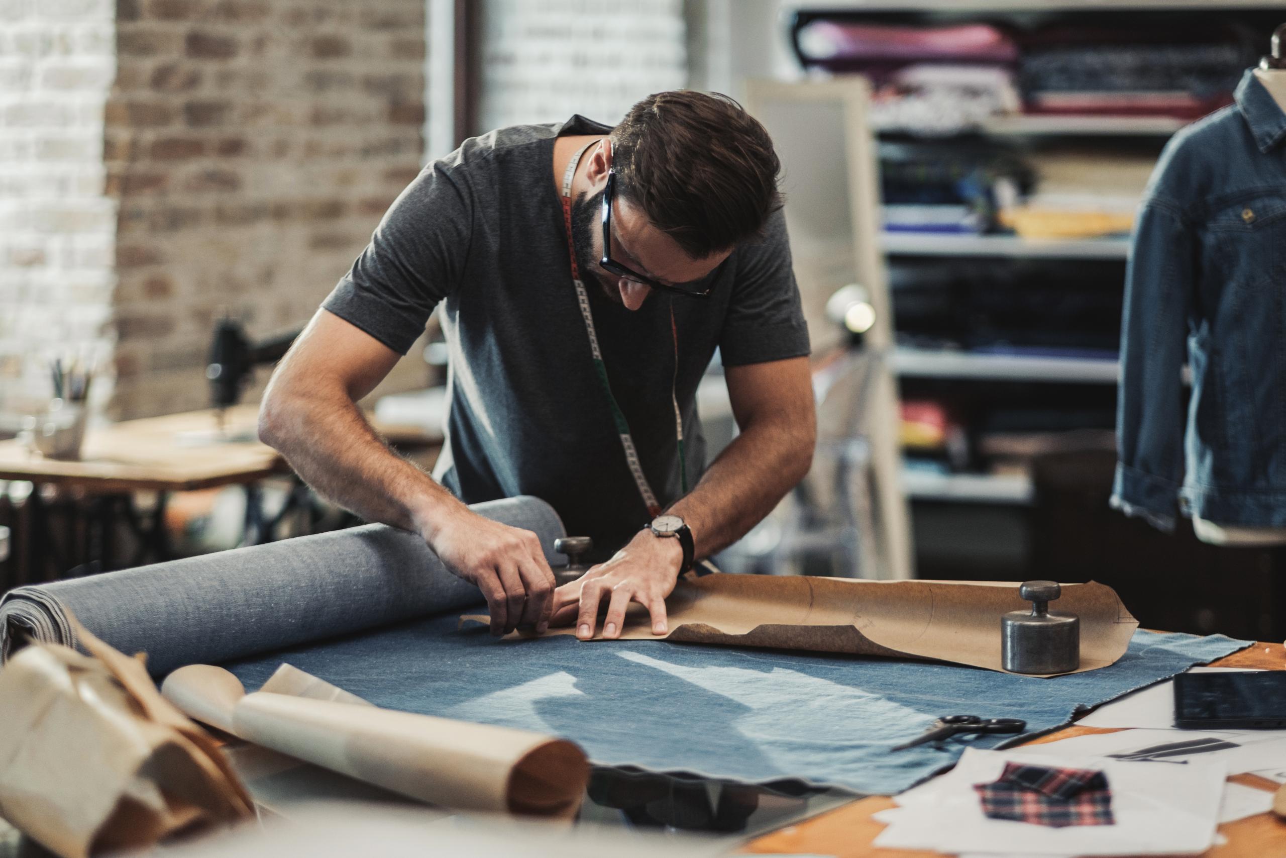 Fashion Designer Working In His Studio